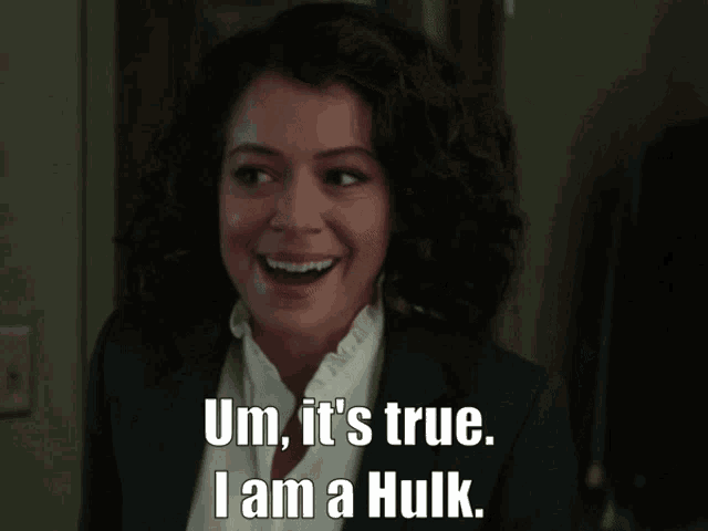 a woman in a suit is smiling and says um it 's true i am a hulk