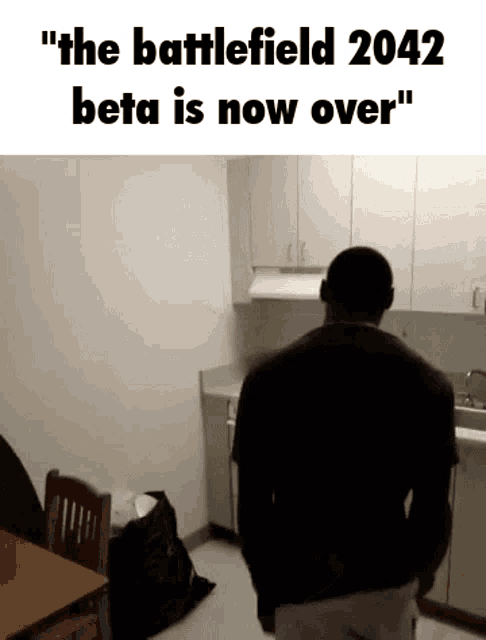 a man standing in a kitchen with the words " the battlefield 2042 beta is now over " on the bottom