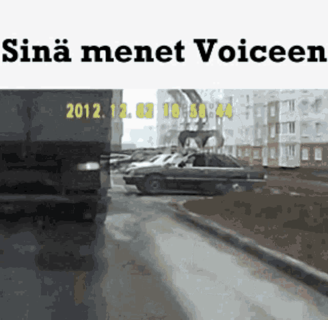 a picture of a car driving down a street with the year 2012 at the bottom