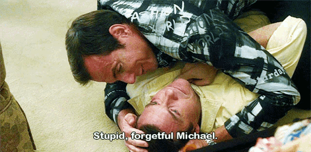two men are laying on the floor and one of them says " stupid forgetful michael "