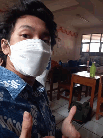 a man wearing a face mask that says selfies