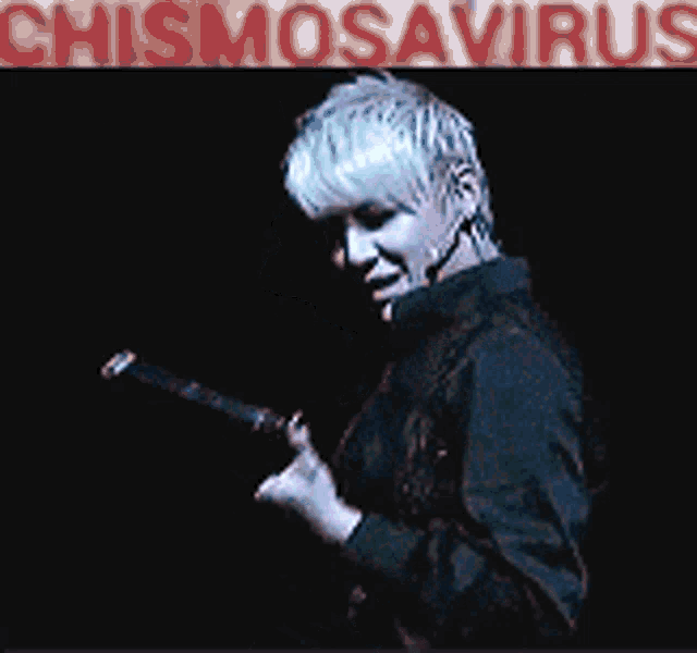 a poster for chismosaurus shows a man in a black jacket holding a guitar