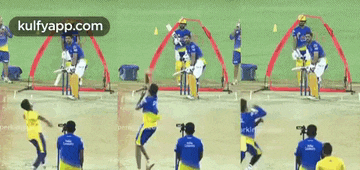 a group of cricket players are playing a game of cricket on a field with the website kulfyapp.com at the top
