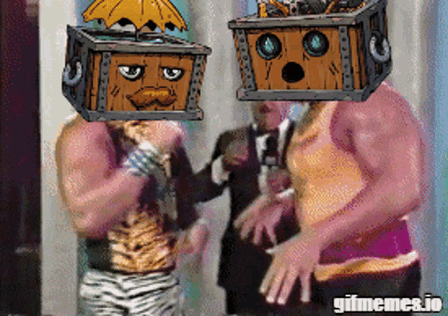 two men wearing boxes on their heads are standing next to each other with gifmemes.io at the bottom
