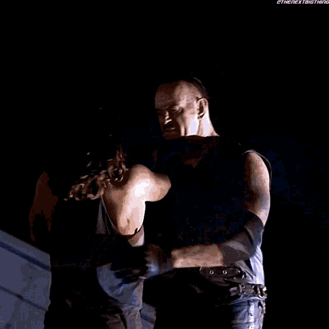 The Undertaker Aj Styles GIF - The Undertaker Aj Styles Chokeslam GIFs