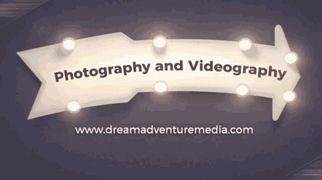 a sign that says photography and videography with the website www.dreamadventuremedia.com below it