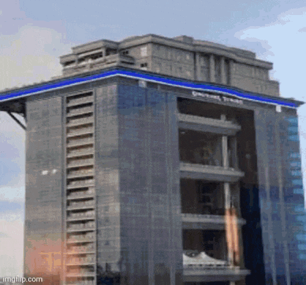 a large building with a blue stripe on the side that says general trust