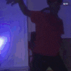 a man in a red shirt is playing a game with a ring
