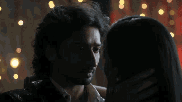 a man touching a woman 's face with the words " life partner ban jao " below him