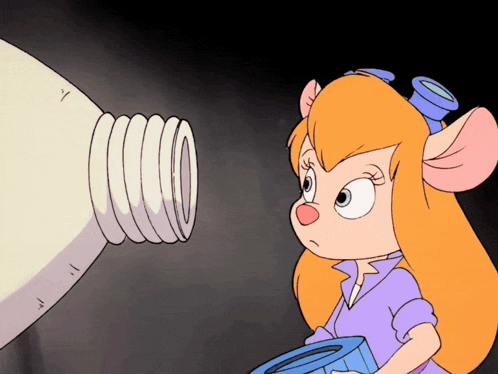 a cartoon mouse is looking at a bottle with the letter t on it