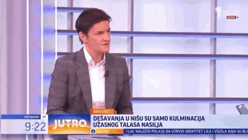 a man in a suit and white shirt is talking on a tv show called jutro