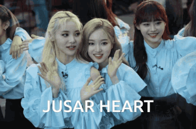 a group of girls are posing for a picture with the words jusar heart written below them