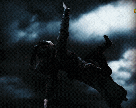 a person is flying through the air in a dark cloudy sky with a yellow sign that says ' a ' on it