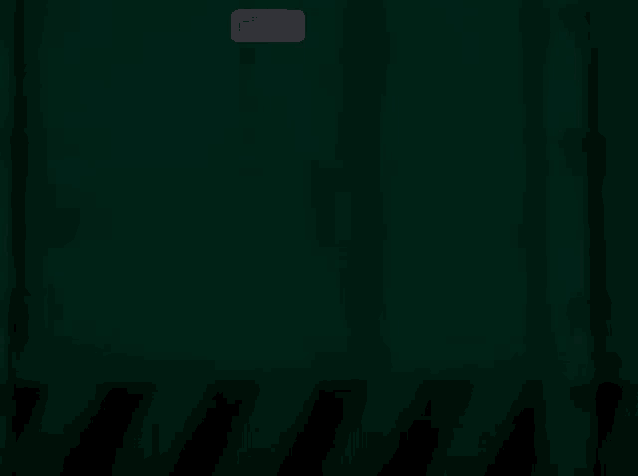 a dark green background with a small icon on the bottom right