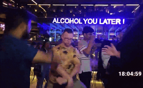 a group of people dancing in front of a sign that reads alcohol you later