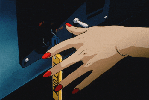 a woman 's hand with red nails is pushing a button that says start