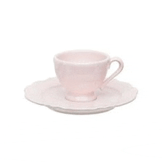 a pink cup and saucer on a white surface .