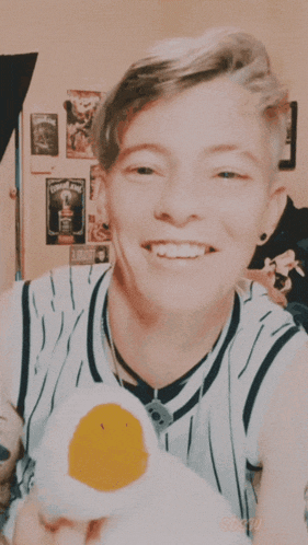 a close up of a person 's face with a smile on it