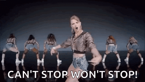 a woman is dancing in front of a group of dancers .