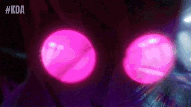 a close up of a person 's eyes glowing in the dark