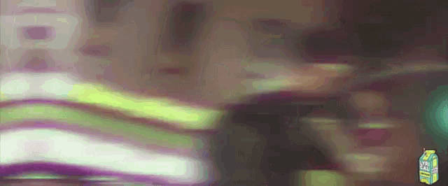 a box of lychee juice is being displayed on a blurry background
