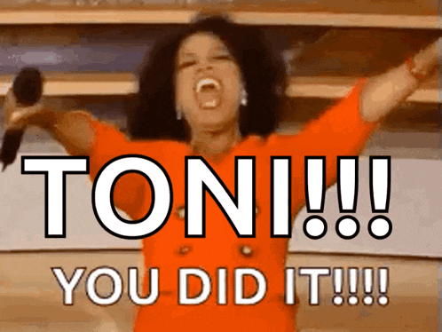 a woman in an orange dress is holding a microphone with her arms in the air and the words toni you did it