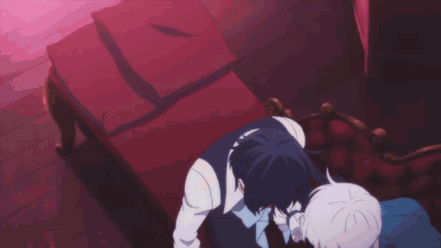 two anime characters are standing next to each other on a red couch
