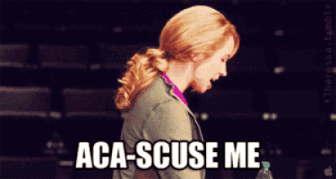 a woman says " aca-scuse me " while holding a bottle