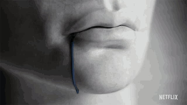 a close up of a person 's mouth with a netflix logo on the bottom right