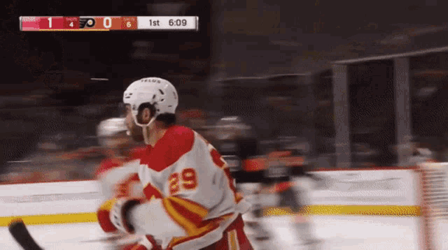 a hockey game is being played and the score is 1 to 0