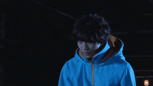 a person in a blue hoodie is surrounded by purple lightning
