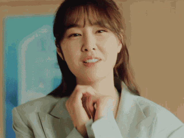 a close up of a woman making a funny face