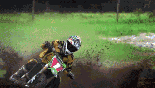 a person riding a dirt bike with a number 7 on the front