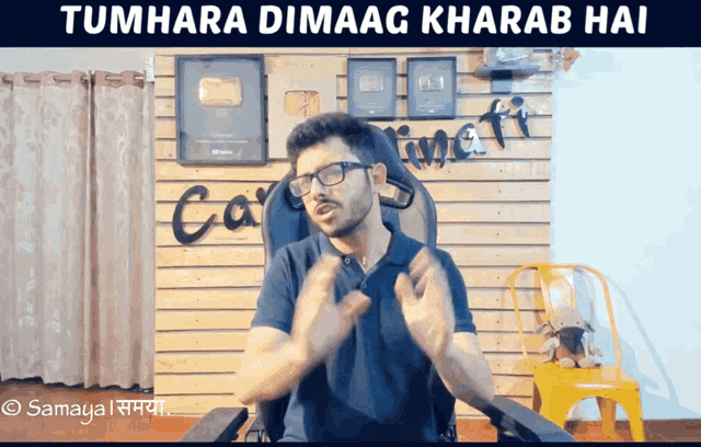 a man sitting in a chair with the words tumhara dimaag kharab hai