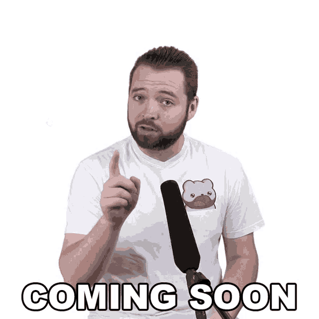 a man holding a microphone with the words coming soon on the bottom