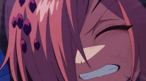 a close up of a girl 's face with purple hair