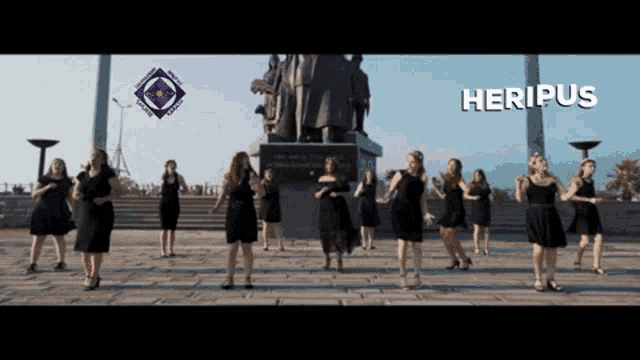 a group of women in black dresses are dancing in front of a statue with the word heripus on the bottom