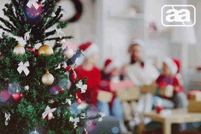 a picture of a christmas tree with the letters aa in the corner