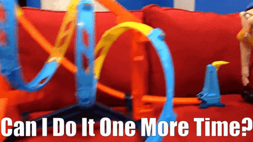 a hot wheels track with the words can i do it one more time on the bottom