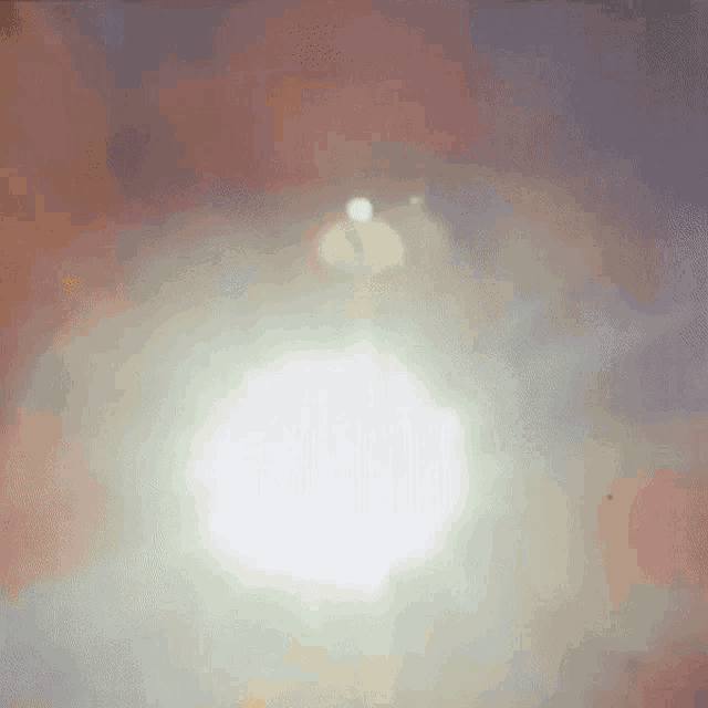 the sun is shining through the clouds in a pink and purple sky