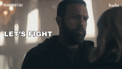 a man says let 's fight while looking at a woman