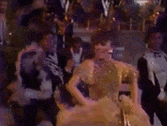 a blurry picture of a group of people dancing on a stage .