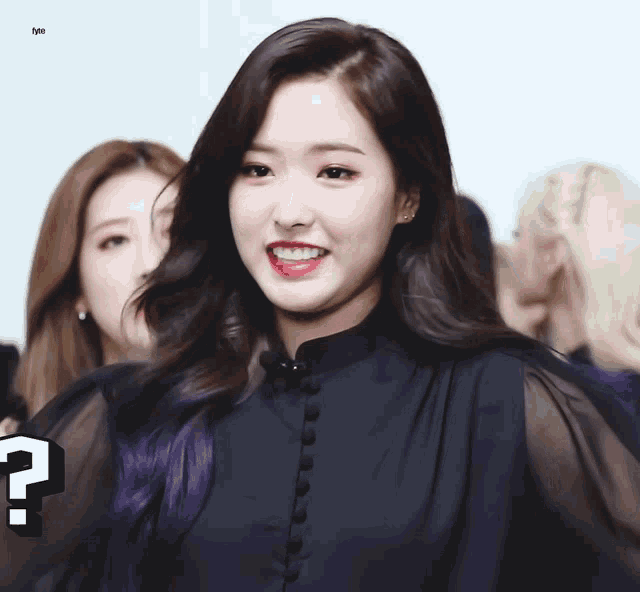 a girl with purple hair is smiling with a question mark in front of her