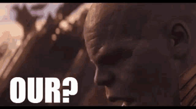 thanos from avengers infinity war is standing in front of a cloudy sky .