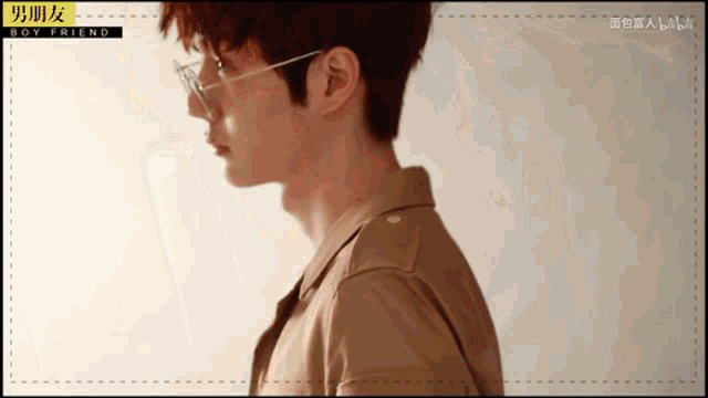 a close up of a man wearing glasses with the words boy friend on the bottom right
