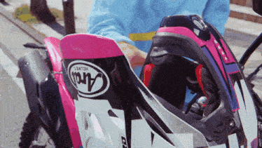 a person wearing an arai helmet on a motorcycle