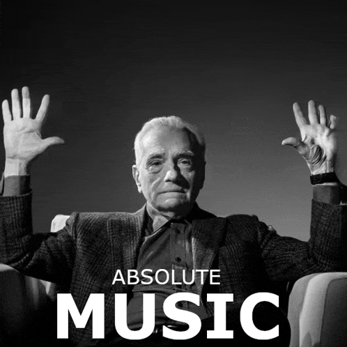 a black and white photo of an older man with his hands in the air and the words absolute music below him