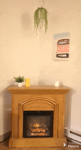a fireplace with a painting of a red van on the wall above it