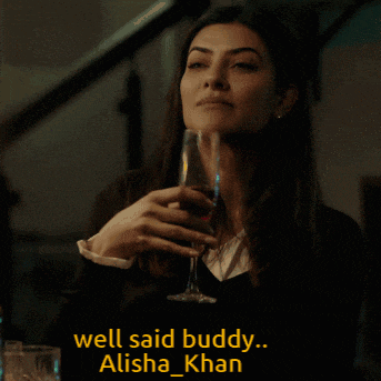 a woman holding a glass of wine with the caption well said buddy alisha khan