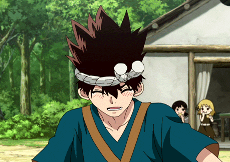 a boy in a blue shirt with a headband around his head